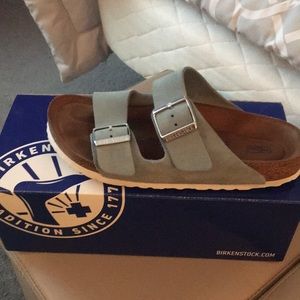 Size 7 Arizona light blue Birkenstock shoes.